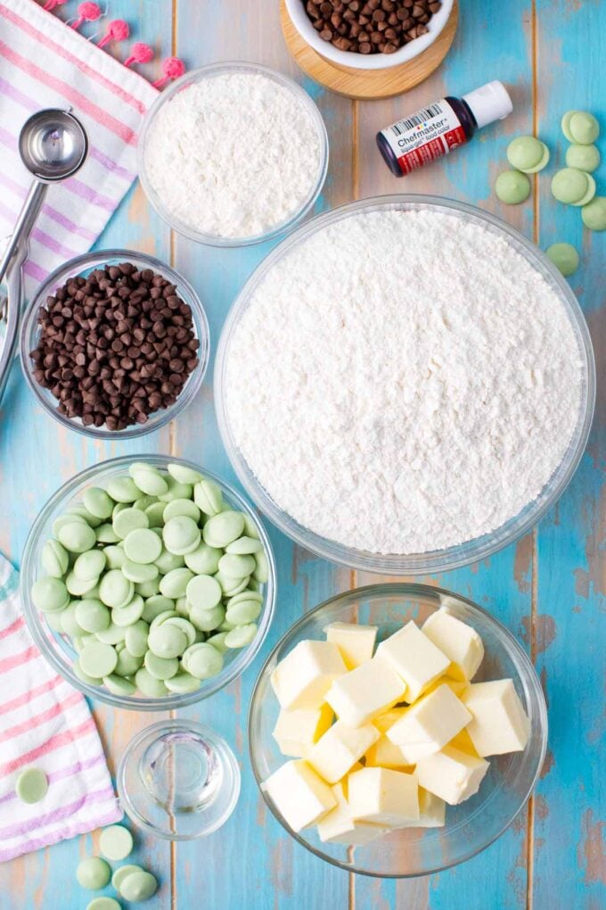 Overhead shot of no bake watermelon truffles ingredients in bowls on a table.