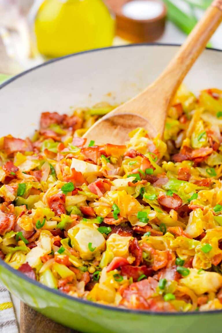 A skillet of perfectly cooked bacon fried cabbage.