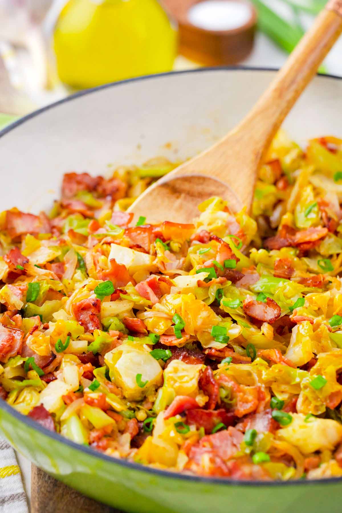 A skillet of perfectly cooked bacon fried cabbage.