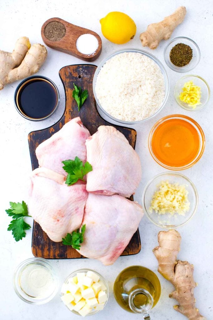 one pan honey garlic chicken and rice ingredients in bowls on a light surface