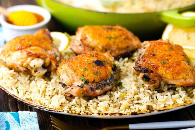 italian chicken and rice made with chicken thighs, arranged on a serving plate