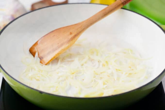 Cooking onions in a skillet.