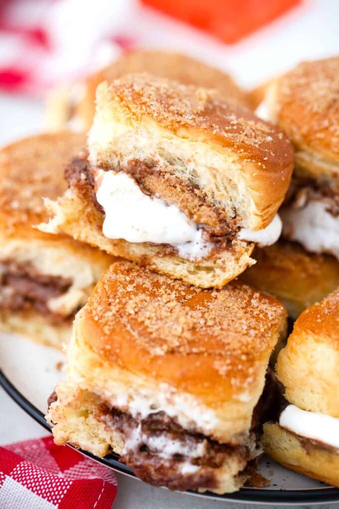 peanut butter cup smores sliders stacked on a plate
