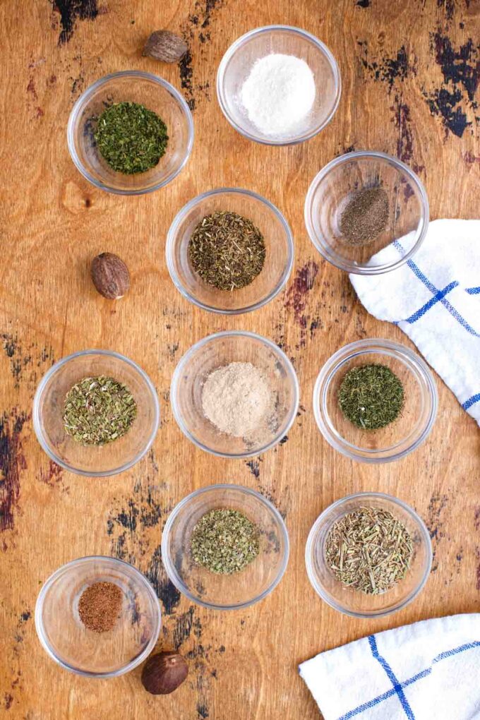 poultry seasoning ingredients in individual bowls on a table