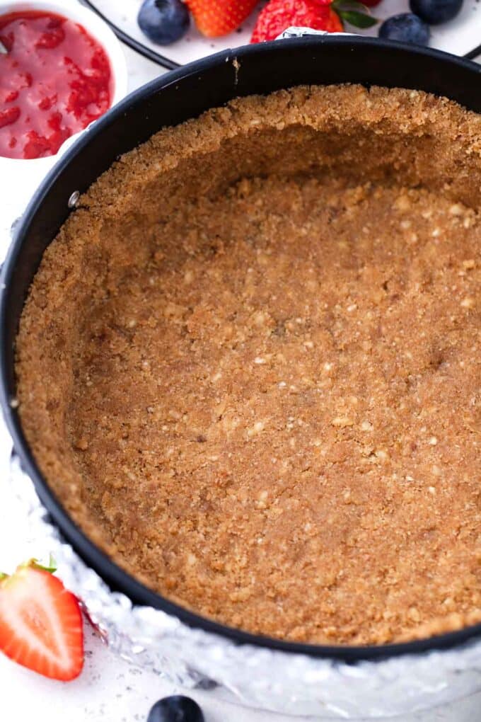 cheesecake graham cracker crust in a springform pan