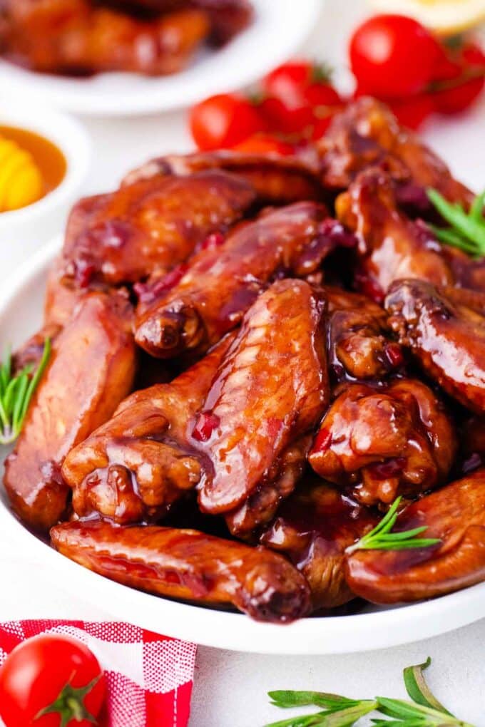 red wine glazed wings covered in a sticky wine glaze sauce