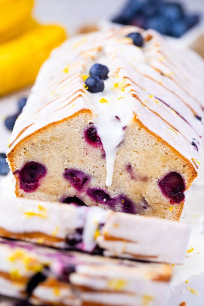 Lemon blueberry banana bread topped with a glaze.