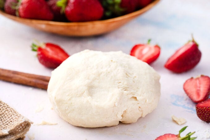 Pie crust dough on a floured surface.