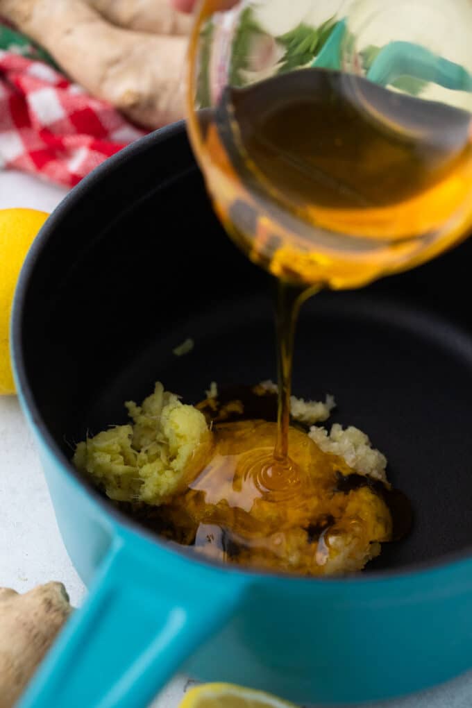 Honey garlic sauce ingredients in a saucepan.