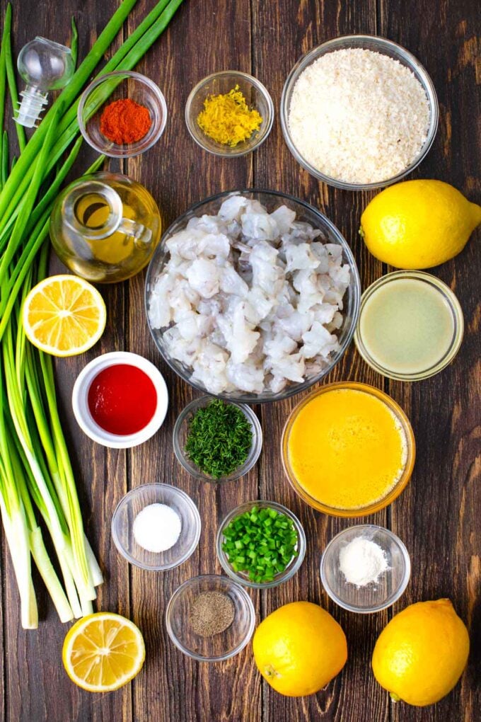 shrimp cakes ingredients in bowls on a table