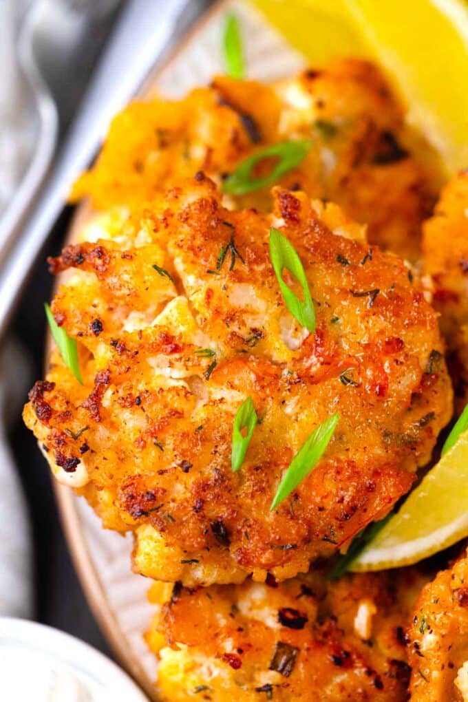 golden-brown shrimp cakes served with lemon