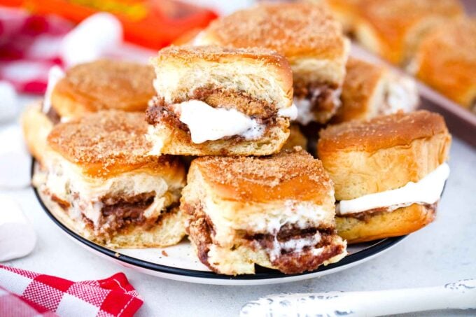a plate with peanut butter cup smores sliders
