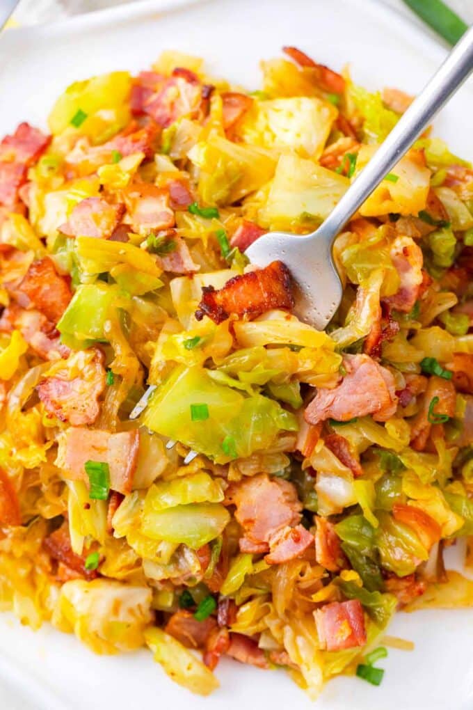 Overhead shot of a plate of bacon fried cabbage.