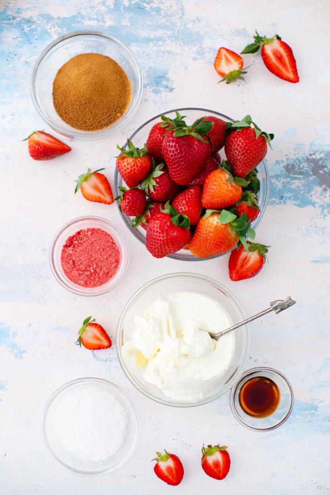 no bake strawberry coconut truffles ingredients in bowls on a light surface
