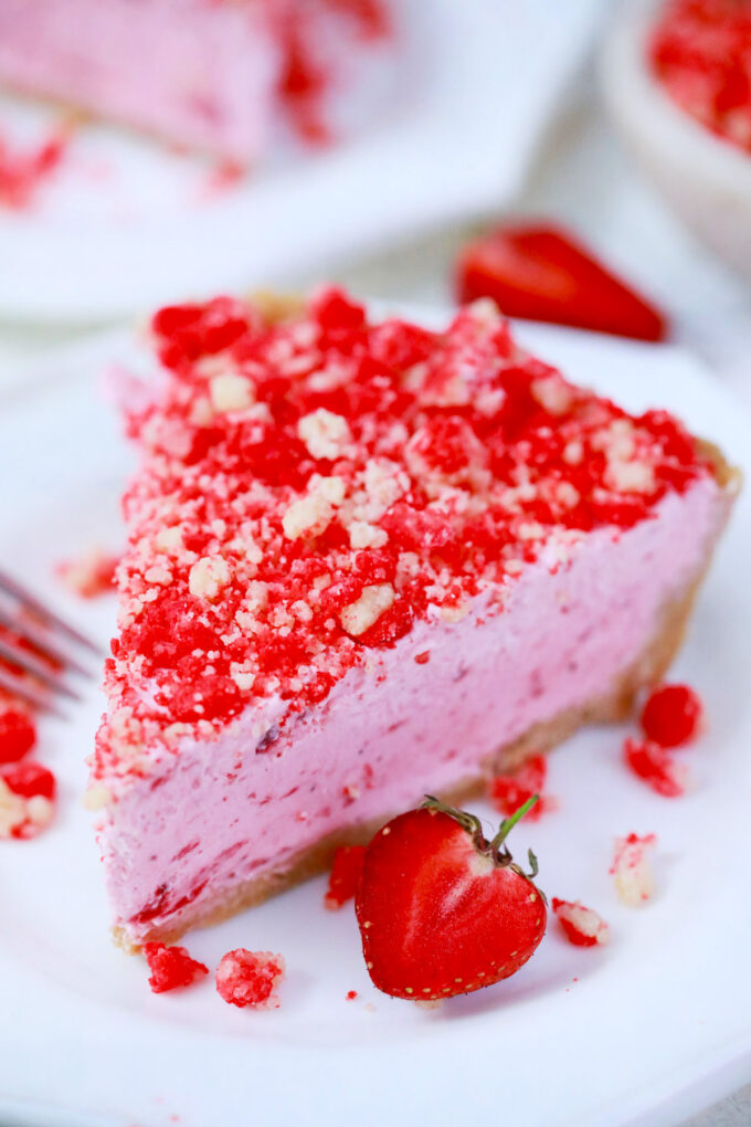 Pink strawberry shortcake pie with strawberry crumb topping.