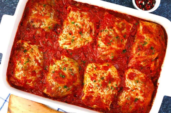 stuffed cabbage rolls in tomato sauce in a casserole