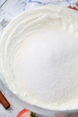 beating sugar into cream cheese mixture