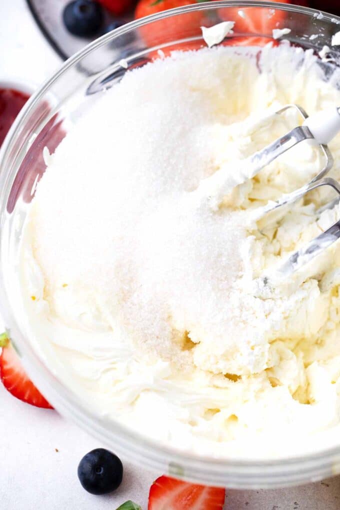 beating sugar and cream cheese