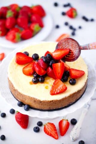 adding berry topping to instant pot cheesecake