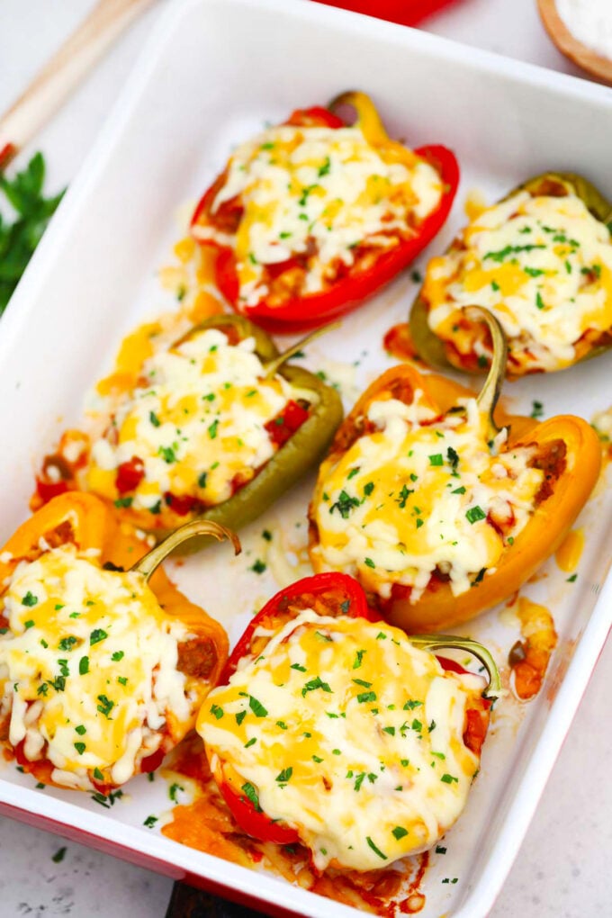 Mexican stuffed peppers in a baking dish.