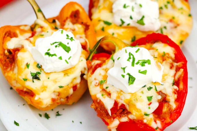 Cheesy Mexican stuffed peppers topped with sour cream.