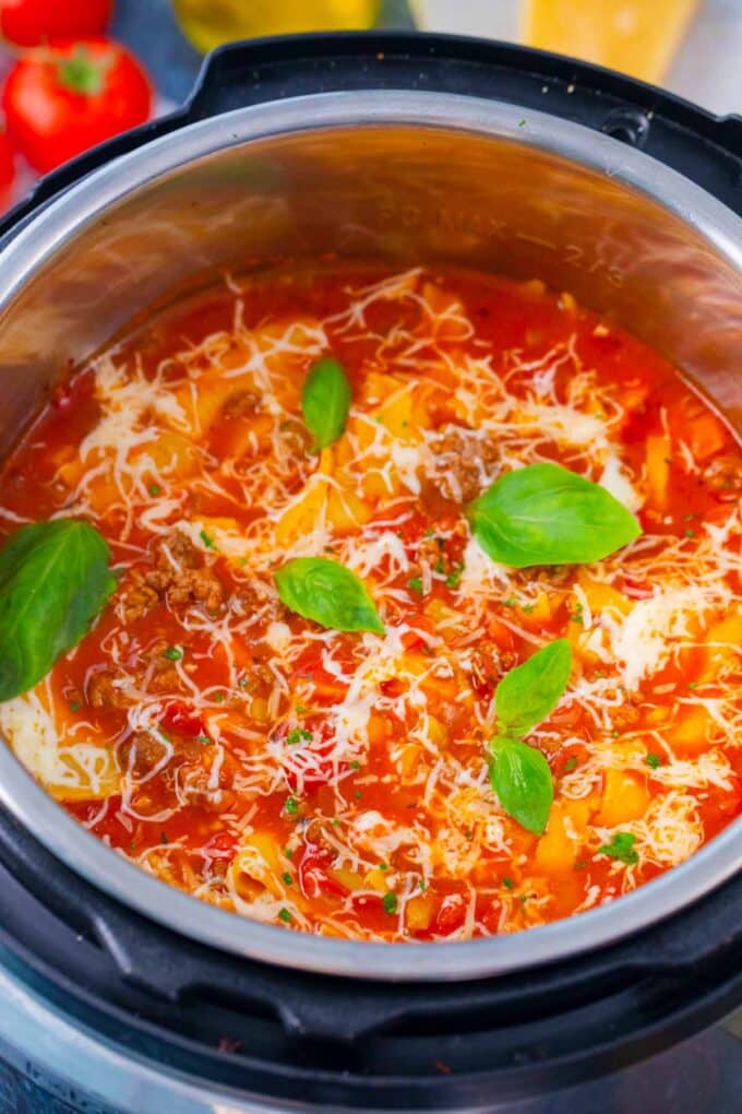 Overhead shot of homemade Instant Pot lasagna soup topped with cheese.