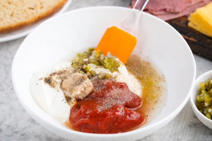 Mixing the ingredients for Russian dressing.