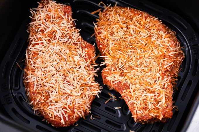 Air frying parmesan crusted pork chops.