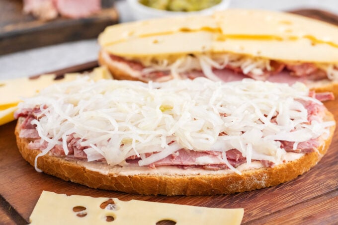 Assembling a homemade Reuben sandwich.