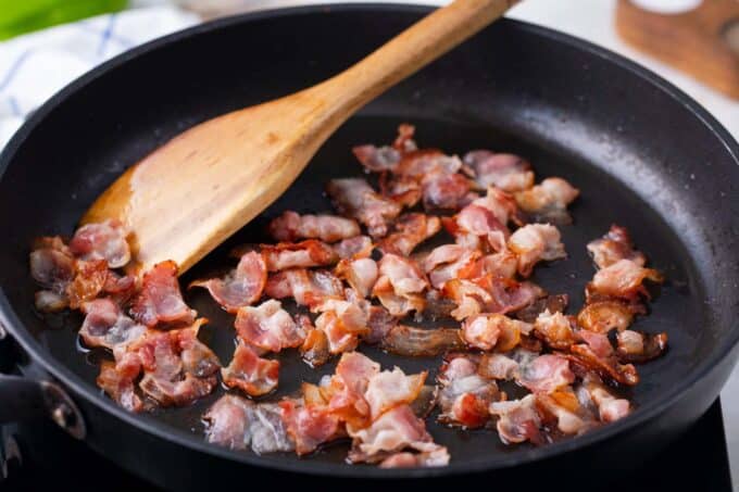 Cooking bacon in a pan.