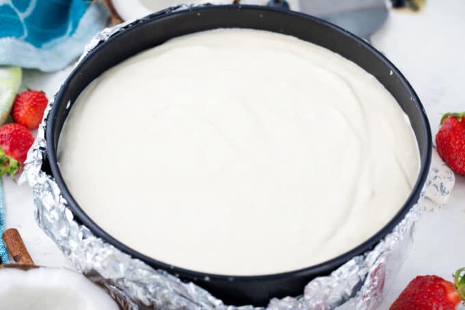 Keto cheesecake in a springform pan before baking it.
