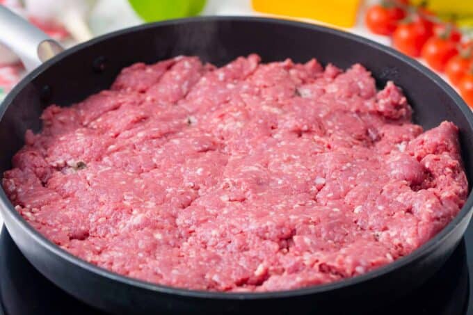 Browning ground beef in a skillet.