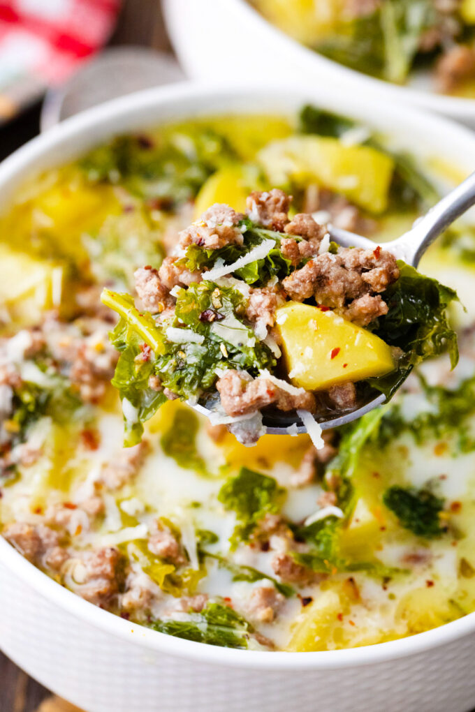 Close shot of a spoonful of instant pot zuppa toscana soup.