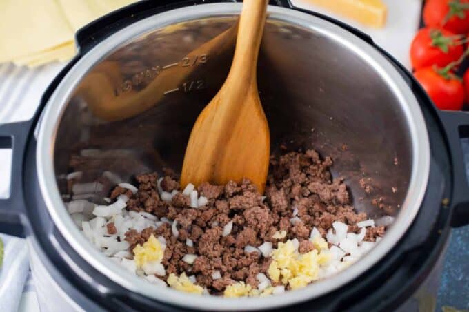 Browning beef with onion and garlic in the Instant Pot.
