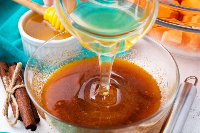Adding honey to butter brown sugar glaze.