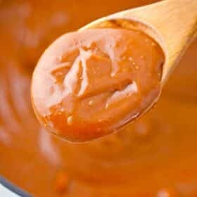 a spoonful or creamy and thick caramel sauce