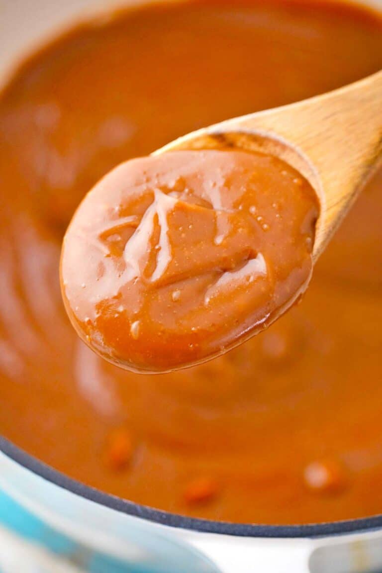 a spoonful or creamy and thick caramel sauce