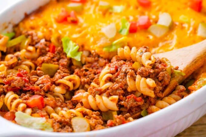 Scooping cheeseburger casserole made with pasta and lots of cheese.