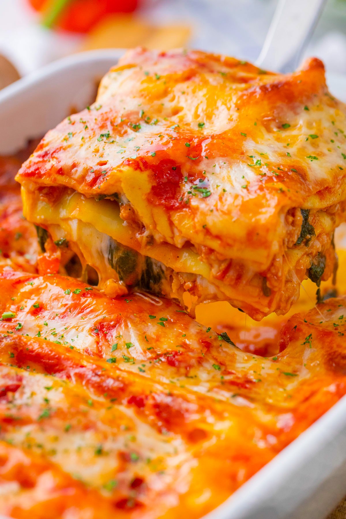 A serving of chicken spinach lasagna.