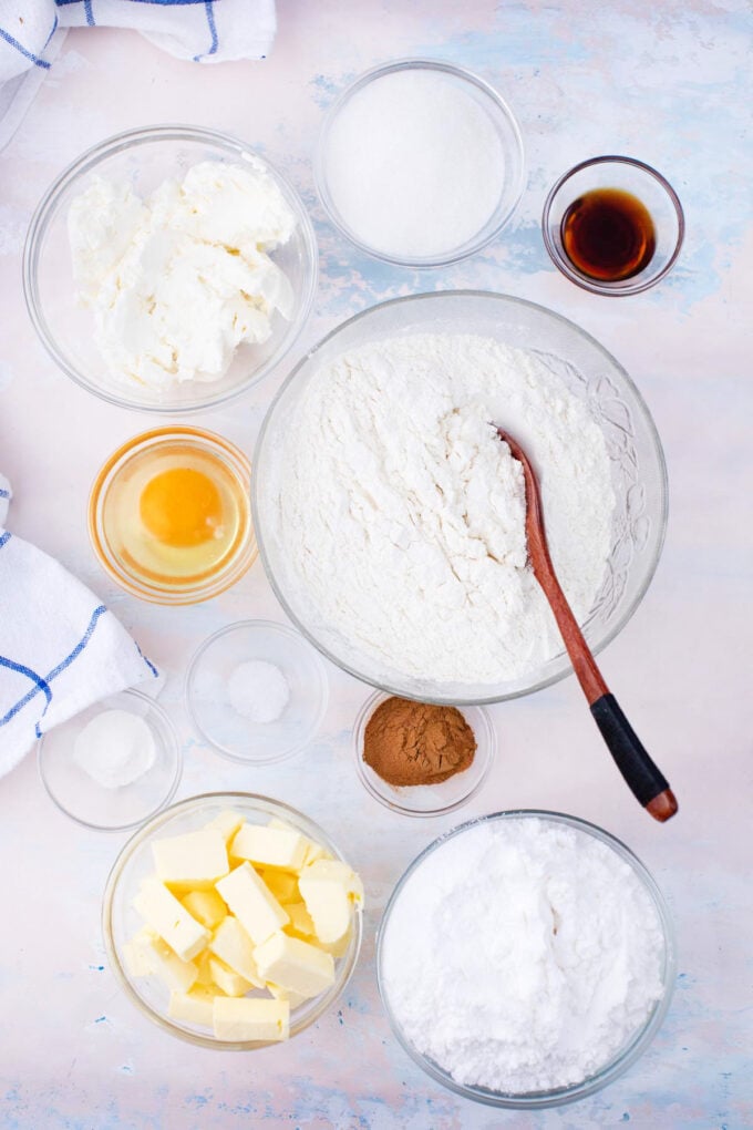 Overhead shot of cinnamon cream cheese cookie ingredients in bowls.