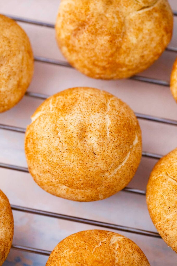 Homemade cinnamon cream cheese cookies on a cooling rack.
