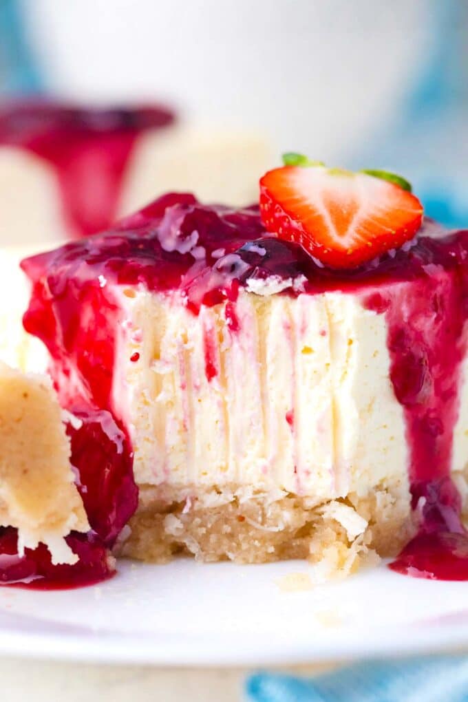 Close shot of a keto cheesecake slice with fork marks.