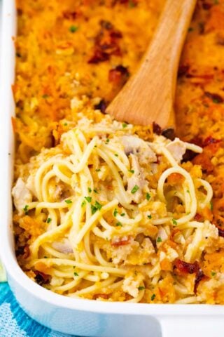 A serving spoon of crack chicken spaghetti casserole.