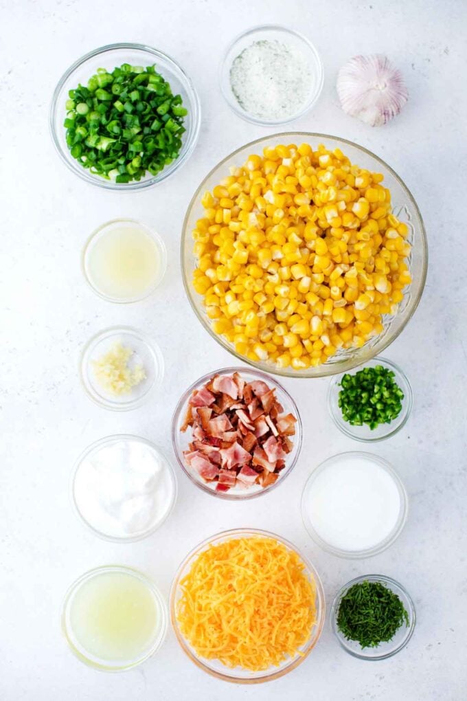 crack corn salad ingredients in bowls on a table