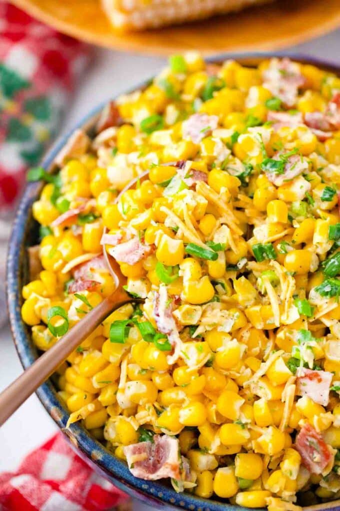 bacon cheddar ranch corn salad topped with chopped green onions