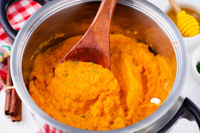 A pot of creamy mashed sweet potatoes.