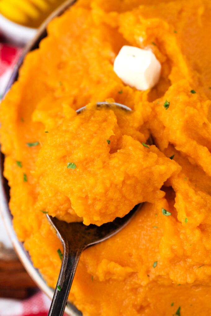 A spoonful of mashed sweet potatoes.