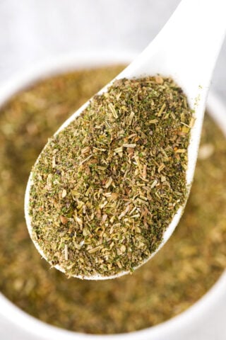 A spoonful of Italian seasoning mix.