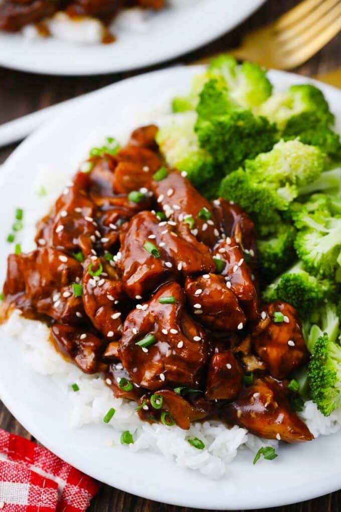 instant pot general tso chicken served on top of rice with broccoli