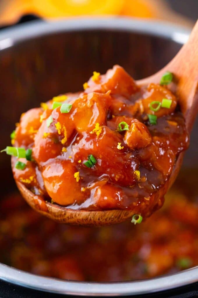 a large serving spoon of instant pot orange chicken